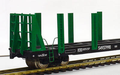Модель вагона-платформы для перевозки труб масштабная модель